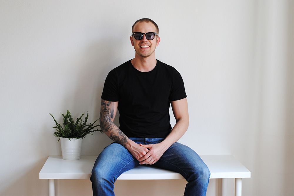 eyerim office series, creative office, Branislav the brand manager wearing 35/139 Tokyo Bekko 2 Sunglasses in Indigo